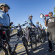 Asa Khalif (right), a national organizer for Black Lives Matter, uses his bullhorn to address the line of Philadelphia Bicycle Police Officers blocking the entrance to the Fraternal Order of Police headquarters on Sunday. (Michael Bryant/Philadelphia Inquirer)
